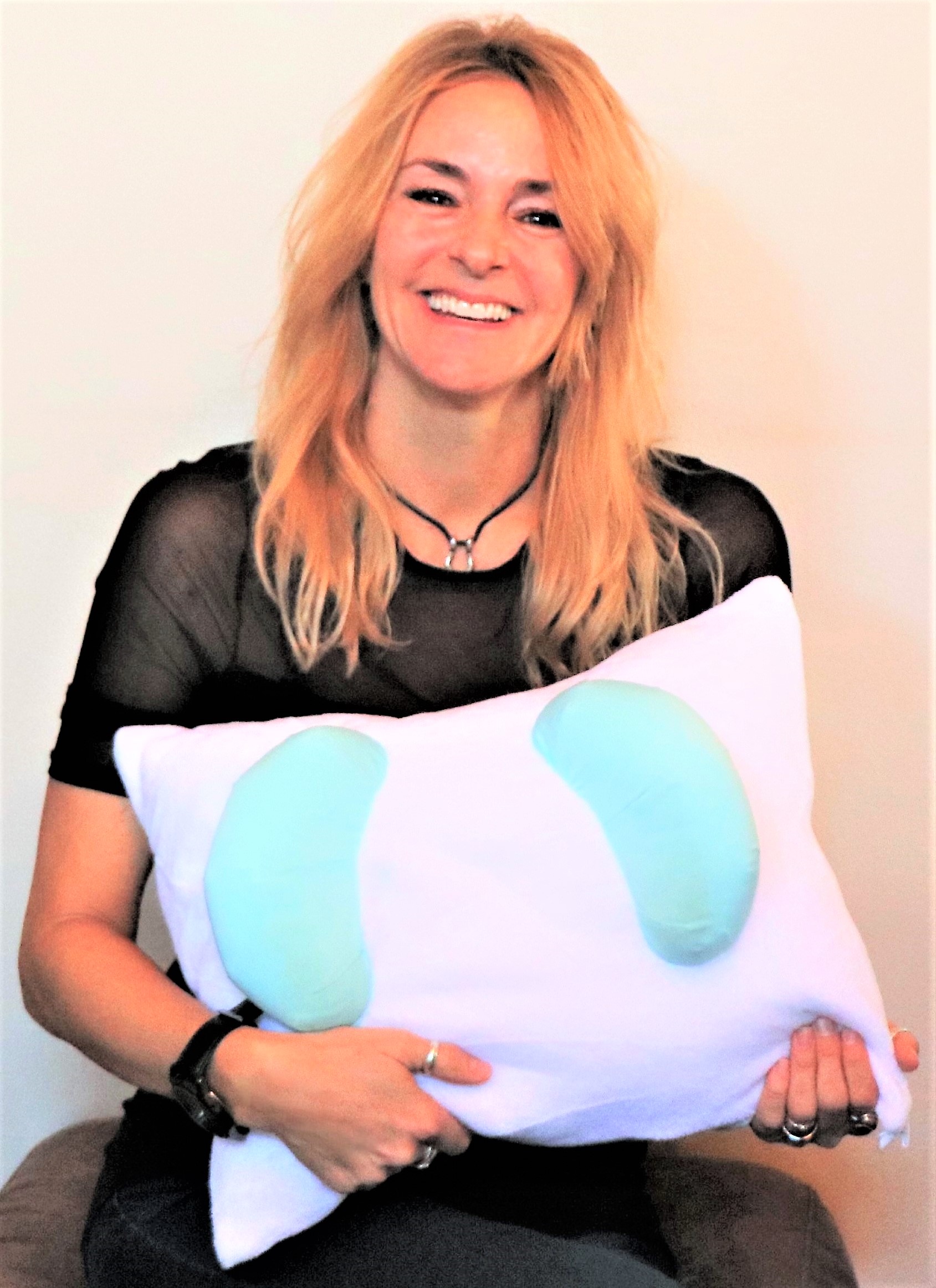 Helene, the inventor of the Back to Beauty Anti Wrinkle Head Cradle Beauty Pillow for Back Sleeping Beauty Sleep for Anti Aging Wrinkle Prevention also great for Anti Acne